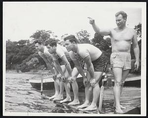 Lifeguard Drill at Jamaica Pond, in preparation for the season's opening. Alex Houston (pointing), director of water safety for the Red Cross in Boston, about to start William Messenheimer, Donald E. Callow and Wilbur Lewis (left to right), lifeguards, on a fast swim.