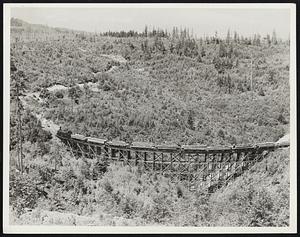 Lumber. Washington State. Log train running through 2nd growth
