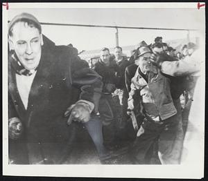 Rivals Unions Clash--This is the scene at the International Harvester Co. plant in East Moline, III., yesterday as some 300 members of rival CIO unions clashed in free-for-all battle. Police said fists, crowbars, and brass-knuckles were used in the fight.