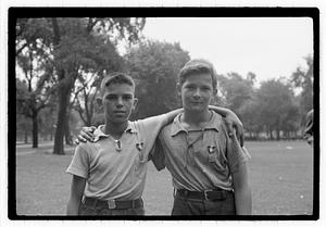 Two boys, both wearing medals