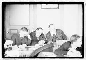 Group of men at table
