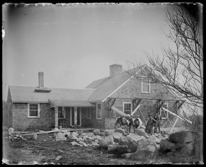 House being shingled. 2 oxen, 2 men