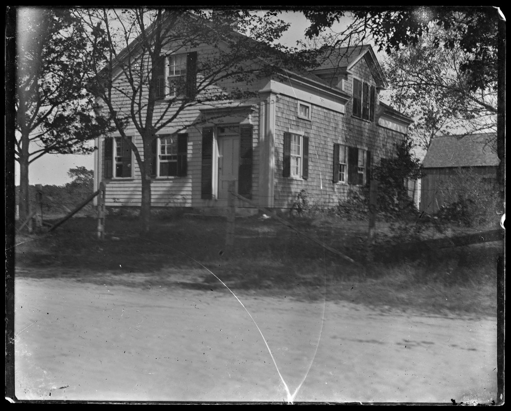 House with barn on little rise - near road