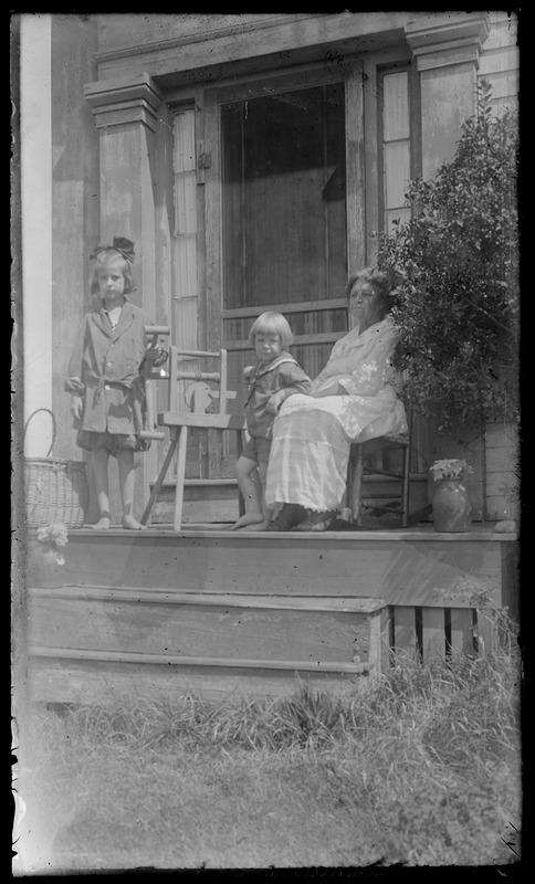 Grandma & 2 young children on porch