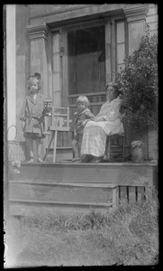 Grandma & 2 young children on porch