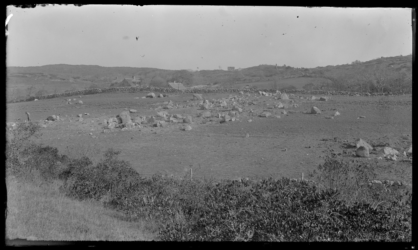 Houses - lots of rocks, man to one side