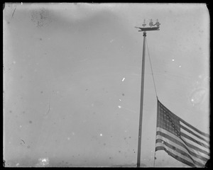 Ship weathervane on flagpole
