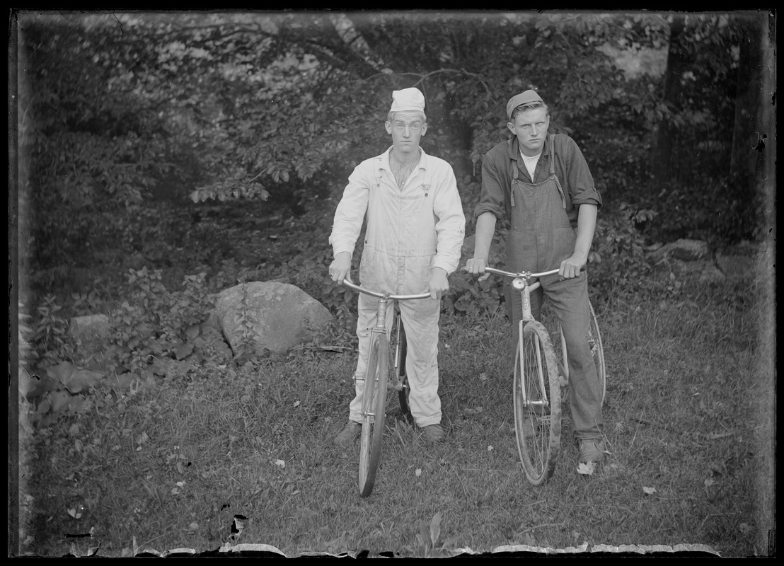 2 young men/bicycles