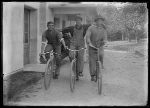 3 young men - bikes. House similar to Seven Gates