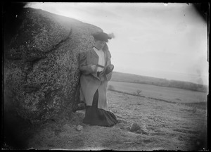 Woman with foot on stone. Costume?