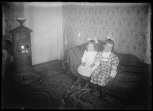 2 children, coal stove in house for ordinary people