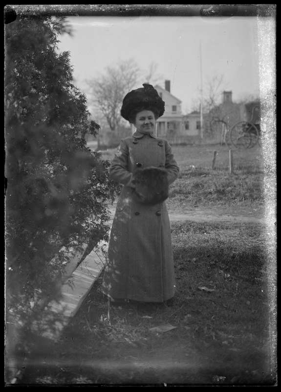 Lady & house, unidentified