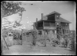 Fancy house on rise - widow's walk. Fence down in back