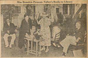 Miss Susan Brandeis presents books written and autographed by her father, Supreme Court Justice Louis D. Brandeis, to the library in South Yarmouth, Mass.