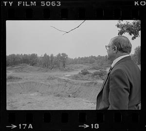 Peter Matthews looking at vacant lot