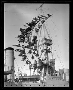 USS Milwaukee in Navy Yard with pennants flying