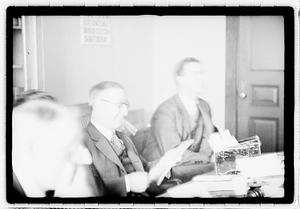 Group of men at table
