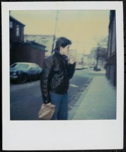 Young woman holding a paper bag