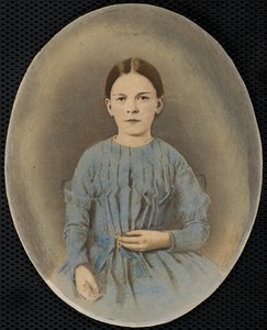 Portrait of young girl in a blue dress