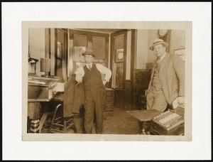 Two businessmen standing in an office