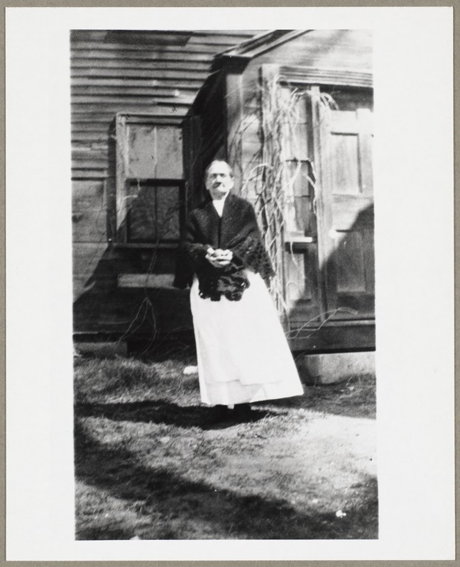 Woman standing by a door