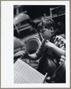 Music students boy playing cello