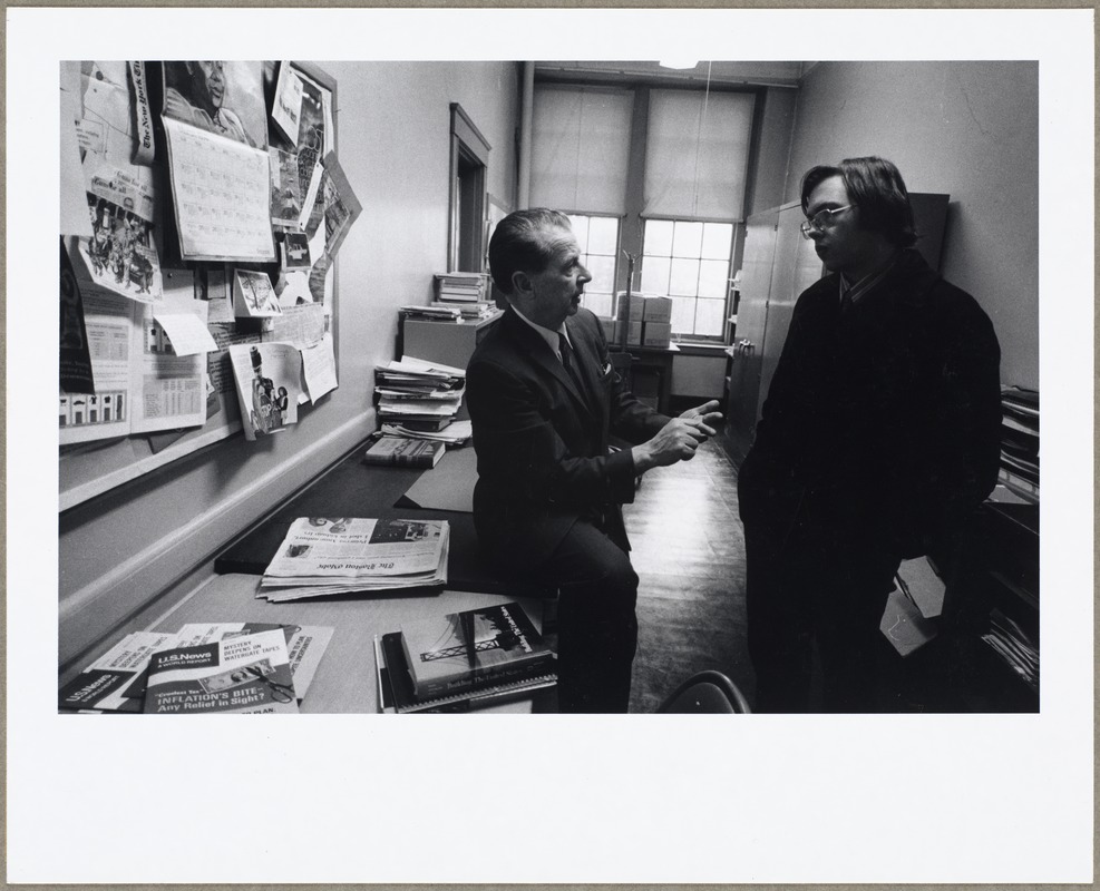 Two men talking together at Arlington High School