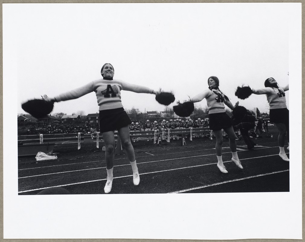 Cheerleaders at football game: Betty Ann Burns, Jean Whitney, Terry Balzer