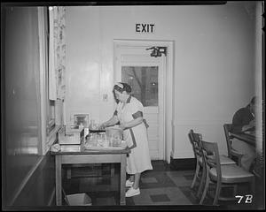 Women gathering dishes