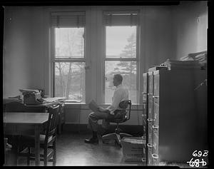 Fred Geisler in chair before window