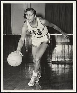 Connie Simmons. Age 26, 6'8" 225lbs. Playing sixth season of pro basketball, third with N.Y. Knicks. Came to the Garden team in 1949 from Baltimore Bullets. New York's fourth leading scorer last season with 604 points. 9.2' average, third in rebounds with 426. Averaged 10.9 in 14 playoff games in 1951. Scored 680, 11.3 average, for third high Knick in 1949-50. Led Baltimore in 1948-49 with 779, 13.0 average, 12th high in league. Bullets got him from Boston Celtics late in 1947-48 and he sparked Baltimore to Championship, scoring 176 points in 11 playoff games. Boston's top scorer in 1946-47 with 620. hits well with either hand out of pivot spot and with two-hand overhead set. Served 3 yrs. in Army, two overseas. Born in Newark, N.J.