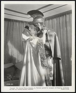 Sign of the Pagan Gladiators Ludmilla Tcherina, as a Roman princess, and Jeff Chandler, as a Roman warrior, provide the romantic spark in Universal-International's dramatic spectacle of 5th century Europe, "Sign of the Pagan," filmed in Technicolor and in CinemaScope starring Chandler Jack Palance, Miss Tcherina and Rita Gam.