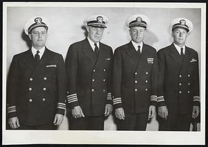 Pictured are the Commander of the Divisions of the Organized Reserve for the Boston area: L. to R. Lt. Cdr. Joseph W. Fitzpatrick, Medford, Mass, 4th Division Commander; Capt. E. J. Freeman, Administration and Activatiation Officer for the Battalion, Belmont, Mass.; Cdr. Charles F. Adams, Jr., Dover, Mass., Battalion Commander; Lr. Cdr. F. A. Harding, Jr., Donham, Mass., 3rd Division Commander.