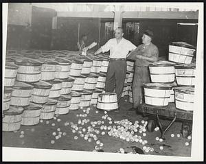 Fruit Stock Begins to Spoil-At the strike-bound Boston Market Terminal, fruit and vegetables held idle by the current dispute today began to go bad. Examining spoiled peaches William Gherardine (left) of the Angelo Fruit Company and Edmund L. Poli, a buyer.