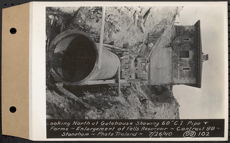 Contract No. 99, Enlargement of Fells High Level Distribution Reservoir, Stoneham, Malden, Melrose, looking north at gatehouse showing 60 inch cast iron pipe and forms, enlargement of Fells Reservoir, Stoneham, Mass., Jul. 26, 1940