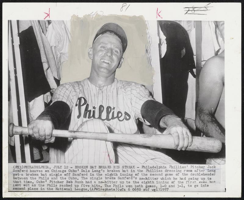 Broken Bat Breaks His Streak - Philadelphia Phillies' Pitcher Jack Sanford heaves on Chicago Cubs' Dale Long's broken bat in the Phillies dressing room after Long got a broken bat single off Sanford in the eighth inning off the second game of the doubleheader between the Phils and the Cubs. The single broke Sanford's no-hitter which he had going up to that time. Cubs' Pitcher Bob Rush had a no-hitter up to the eighth inning of the first game but lost out as the Phils racked up five hits. The Phils won both games, 1-0 and 3-1, to go into second place in the National League.