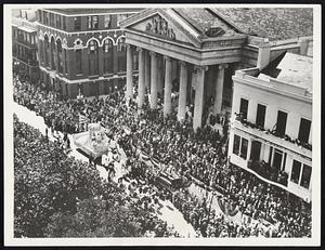 Monarch of Mirth Welcomed The Ruler of the New Orleans Carnival paused to greet the heat of the city government...Rex (Charles McLellan) halts his float in front of the City Hall to exchange toasts with Mayor Robert S. Maestri as the Rex parade moves through the streets lined with half a million spectators.