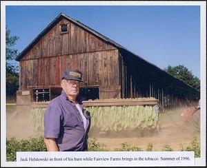 Walter "Jack" Helstowski in front of his barn while Fairview Farms (who were renting the barn) brings in the tobacco