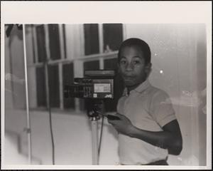 Young man with a film camera