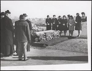 Flower-covered casket of murder victim at Winthrop Cemetery before services were held