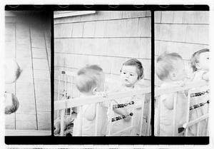 Two children in a playpen