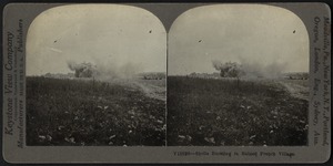 Shells bursting in ruined French village