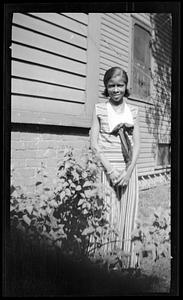 Constance Miller stands posing