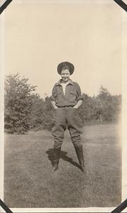 Unidentified young woman standing in a field