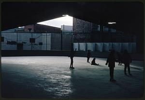 People skating on outdoor ice