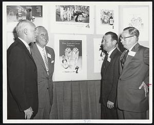 Introduction of House of Seagram Christmas advertising to local distributor salesmen was made by, from left, Joseph A. Callahan, state manager; Herbert W. Evanson, vice president; Milton G. Abramson, eastern division manager; and George Moseley, vice president for advertising and merchandising.