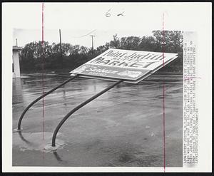 Sign Bent Over By Esther -- This sign was bent over by the high winds of hurricane Esther at Point Judith, R.I. today. Hurricane Esther also deposited up to four inches of rain as it passed the Rhode Island coastline.