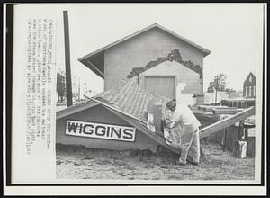 Wiggins, Miss. -- Wiggins Bites The Dust -- Winds of Hurricane Camille knocked the railroad station loading platform roof off its supports when the storm roared through Wiggins last night.