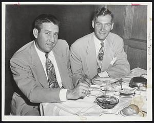 Detroit Tigers' Battery loading up on some ammunition are Catcher Bob Swift (left) and Pitcher Hal Newhouser. Swift, oft-reported coming to the Red Sox in trade, and Prince Hal, ace southpaw, are eating and relaxing at the Kenmore after finding out today's game at Fenway Park had been postponed.