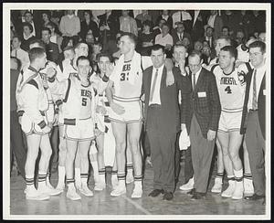 Northeastern & Coach Dick Dukeshire & asst. coach Ken Nolet & Huskies after 2nd straight District 1 NCAA titlee, Frank Ryan, NU's big man, has arm around Duke's shoulder. Team went 21-6.